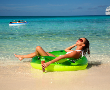 woman enjoying herself on a tropical beach in the bahamas